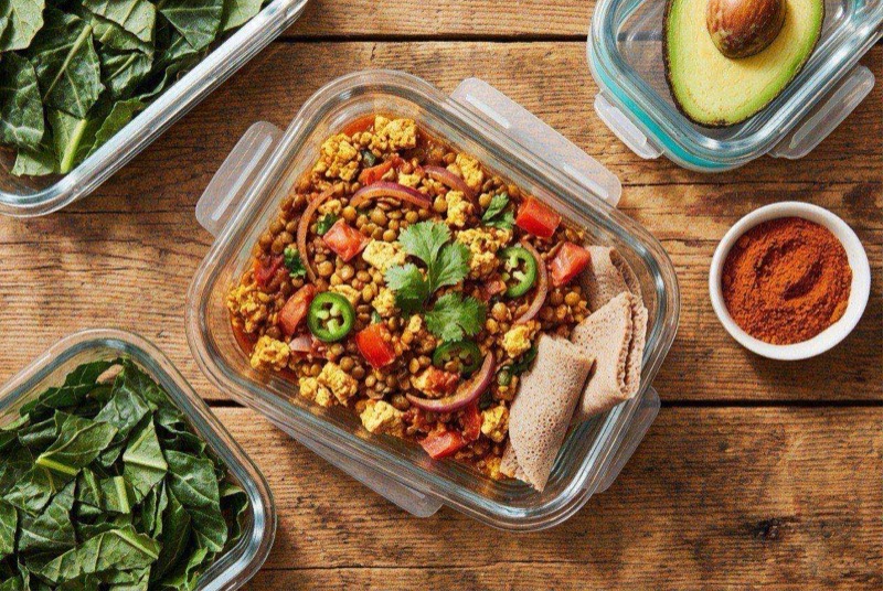 Ethiopian spiced lentil and tofu scramble served on a plate with golden turmeric color and fresh cilantro garnish